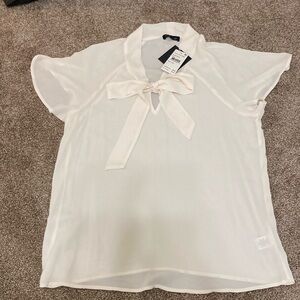 Blouse. Cream color. Never worn. Tags still on. Size small